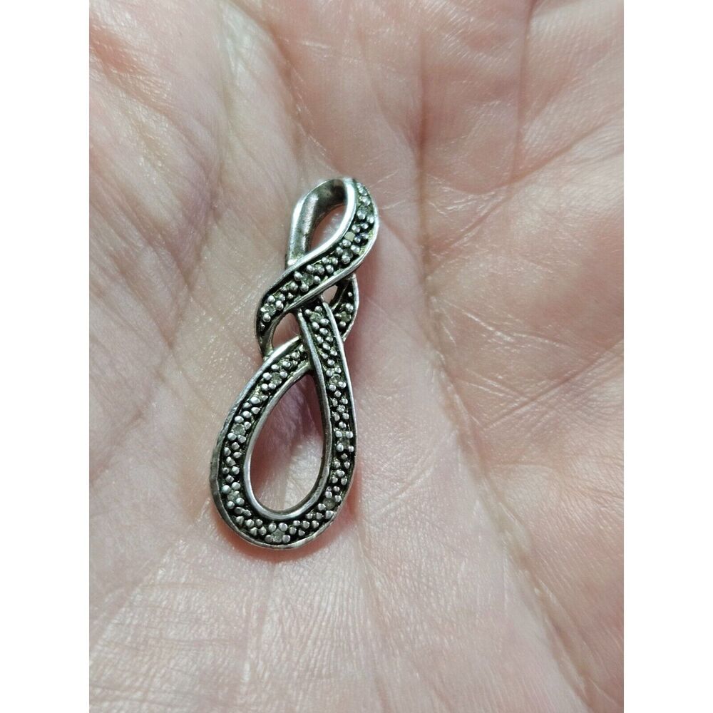 Vintage sterling silver swirly diamond pendant